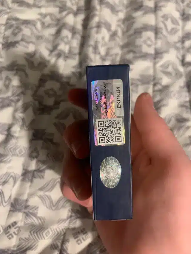 newBig Chief Cartridges: The Complete 2025 Guide - Reviews, Strains & Authenticationa close up of authentic big chief cart packaging highlighting the holographic sticker and qr code for product veri